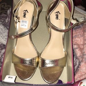 Never been worn. Gold snake printed heels